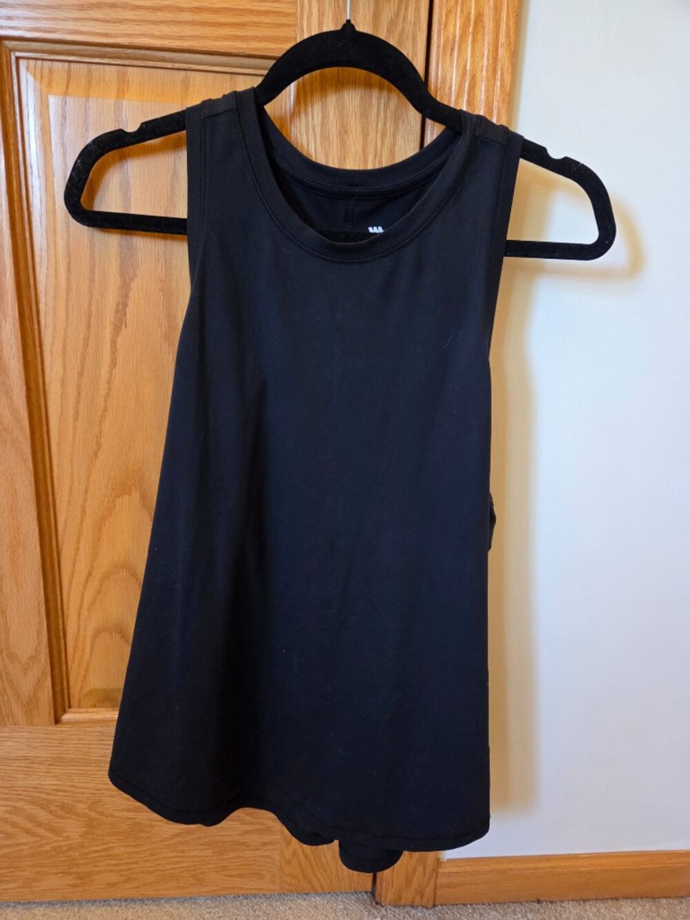 All in Motion black racerback tank FLAWED